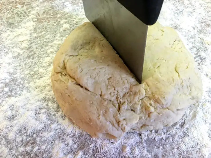 dividing sesame naan bread dough