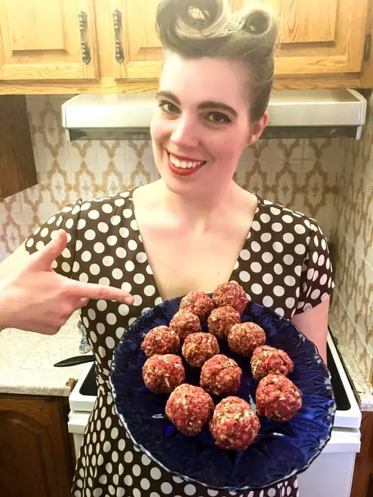 holding a platter of homemade meatballs